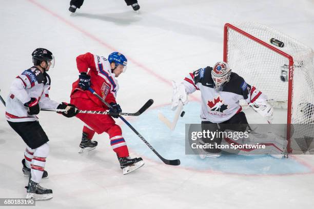 Goalie Calvin Pickard makes a stick save in front of Petr Vrana during the Ice Hockey World Championship between Czech Republic and Canada at...