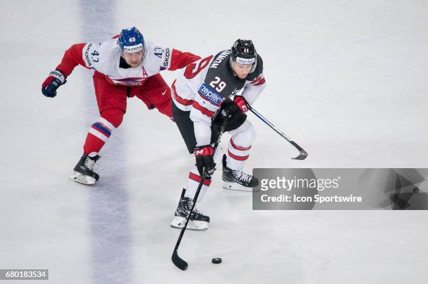 Nathan MacKinnon vies with Jan Kovar during the Ice Hockey World Championship between Czech Republic and Canada at AccorHotels Arena in Paris,...