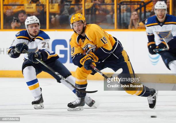 Calle Jarnkrok of the Nashville Predators skates against Vladimir Sobotka of the St. Louis Blues in Game Four of the Western Conference Second Round...