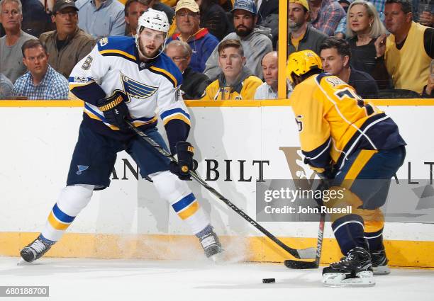 Joel Edmundson of the St. Louis Blues skates against P.K. Subban of the Nashville Predators in Game Four of the Western Conference Second Round...