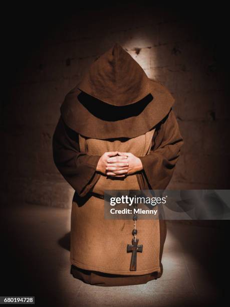 monk praying on his knees in cathedral - apostle of solitude stock pictures, royalty-free photos & images