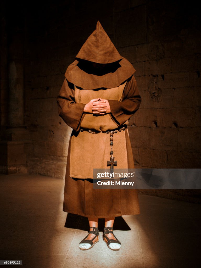 Praying Monk in Cathedral