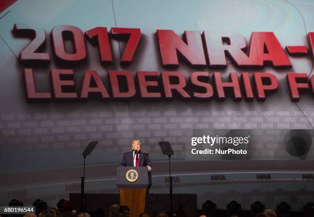 President Donald Trump addresses the National Rifle Association Leadership Forum in Atlanta, Georgia on April 28, 2017. For the first time in 30...