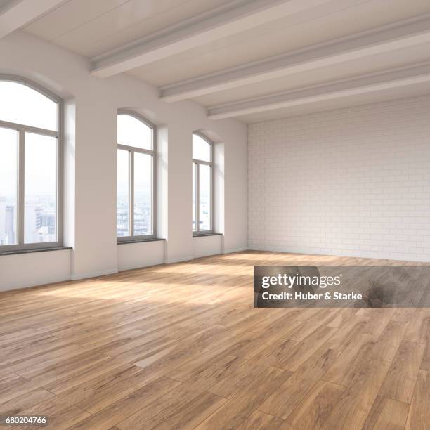 empty loft with view at skyline - schrägansicht stockfoto's en -beelden