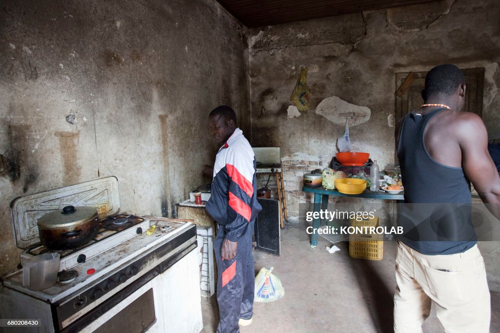 African seasonal workers in an abandoned farmhouse where he...