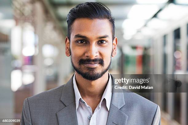 portrait of a young bearded businessman - handsome indian guys stock pictures, royalty-free photos & images