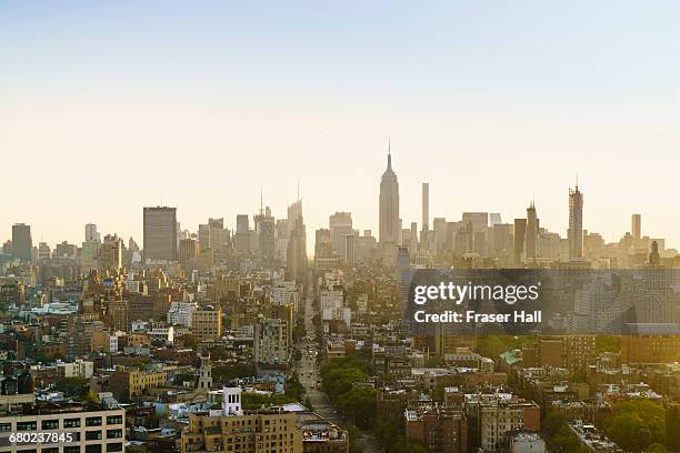 new york skyline at sunrise - soho new york stockfoto's en -beelden