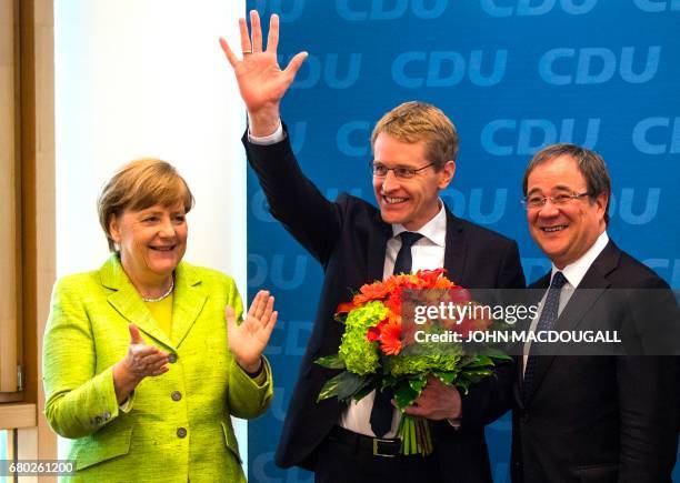 German Chancellor and Christian Democratic Union leader Angela Merkel, CDU candidate in regional elections in Schleswig-Holstein Daniel Guenther and...