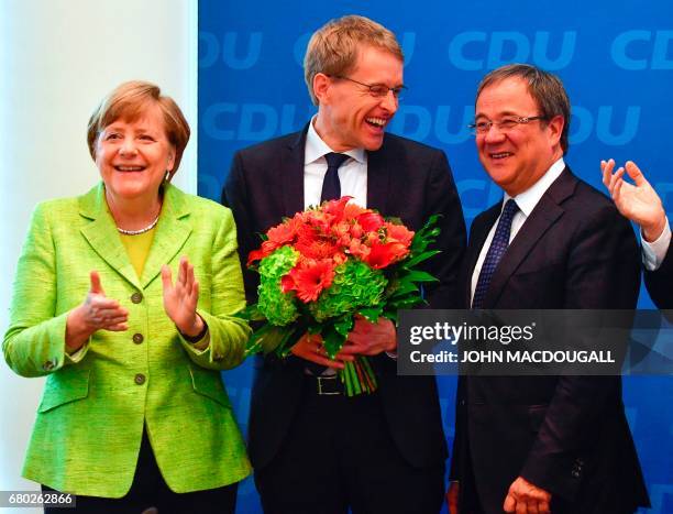 German Chancellor and Christian Democratic Union leader Angela Merkel, CDU candidate in regional elections in Schleswig-Holstein Daniel Guenther and...