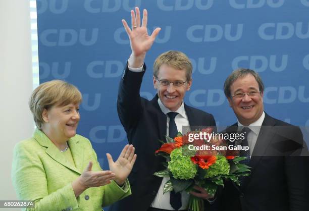 Daniel Guenther, lead candidate of the German Christian Democrats in yesterday's state election in Schleswig-Holstein, waves as he arrives for a...