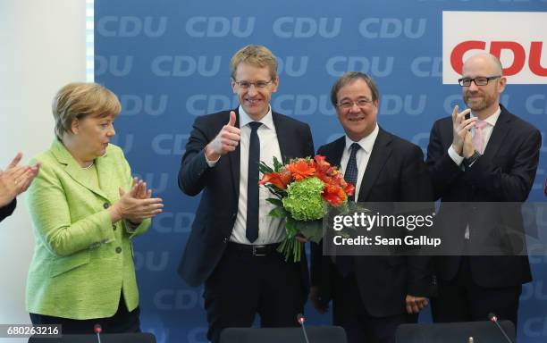 Daniel Guenther , lead candidate of the German Christian Democrats in yesterday's state election in Schleswig-Holstein, shows a thumbs up as he...