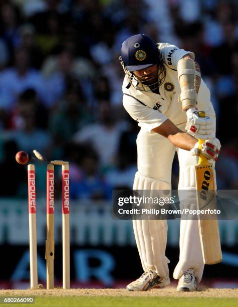 India's VVS Laxman is bowled by England's James Anderson for 24 runs during the 4th Test match against England at the Oval cricket ground in London...