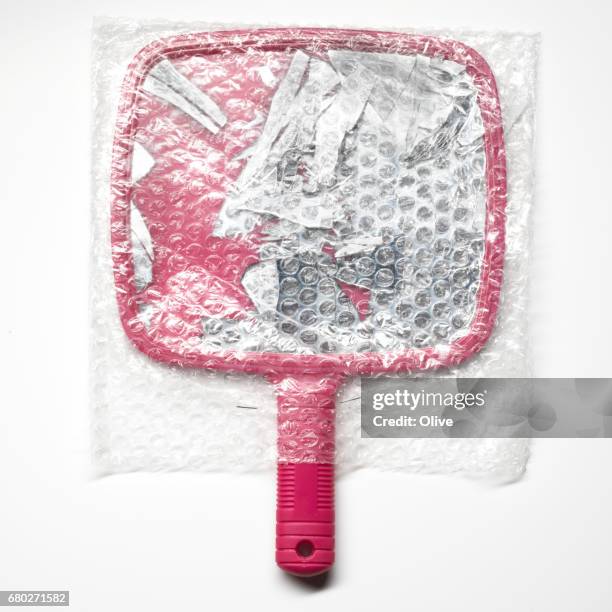broken mirror in its padded envelope - espejo de mano fotografías e imágenes de stock