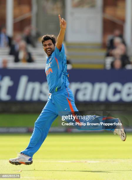 India's RP Singh celebrates after dismissing England captain Alastair Cook during the fourth one-day international cricket match at Lord's cricket...