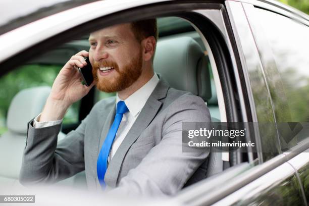 talking on smartphone in the car - luxury baby car seat stock pictures, royalty-free photos & images