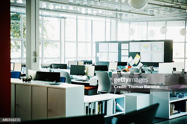 workstations in empty high tech office - empty desk stock pictures, royalty-free photos & images