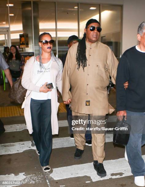 Stevie Wonder and Tomeeka Robyn Bracy are seen at LAX on May 07, 2017 in Los Angeles, California.