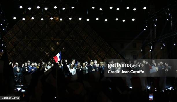 Emmanuel Macron, his wife Brigitte Macron, her daughter Tiphaine Auziere and friends celebrate his presidential election victory at Le Louvre on May...