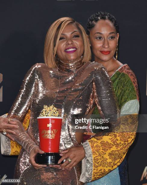 Actors Tracee Ellis Ross and Taraji P. Henson, winner of Best Fight Against the System for 'Hidden Figures', pose in the press room at the 2017 MTV...