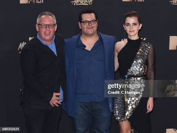 Director Bill Condon and actors Josh Gad and Emma Watson, winners of Movie of the Year for 'Beauty and the Beast', pose in the press room at the 2017...