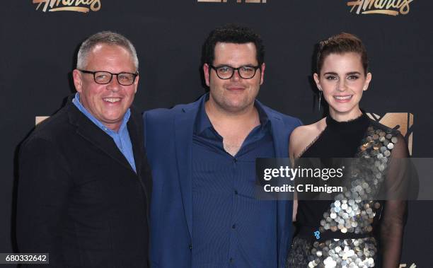 Director Bill Condon and actors Josh Gad and Emma Watson, winners of Movie of the Year for 'Beauty and the Beast', pose in the press room at the 2017...