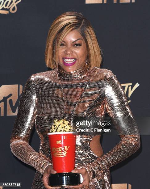 Actor Taraji P. Henson, winner of Best Fight Against the System for 'Hidden Figures', poses in the press room at the 2017 MTV Movie and TV Awards at...