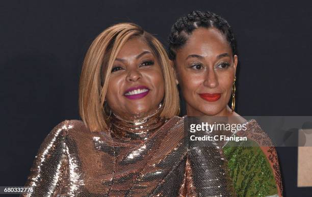 Actors Tracee Ellis Ross and Taraji P. Henson, winner of Best Fight Against the System for 'Hidden Figures', pose in the press room at the 2017 MTV...