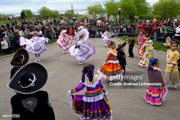 Children in traditional dress gather for Cinco de Mayo festivities in the Sunset Park neighborhood during a Cinco de Mayo parade on May 7, 2017 in...