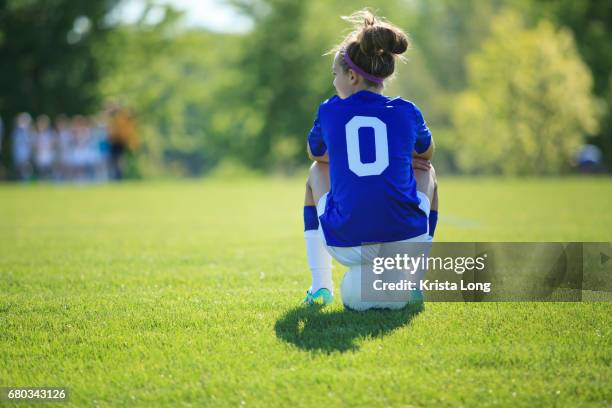 teenage soccer player with soccer field in the background. - american football strip - fotografias e filmes do acervo