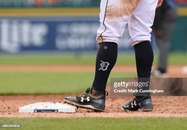 Detailed view of the Stance brand socks with the Old English D logo and Under Armour shoes worn by Tyler Collins of the Detroit Tigers during the...