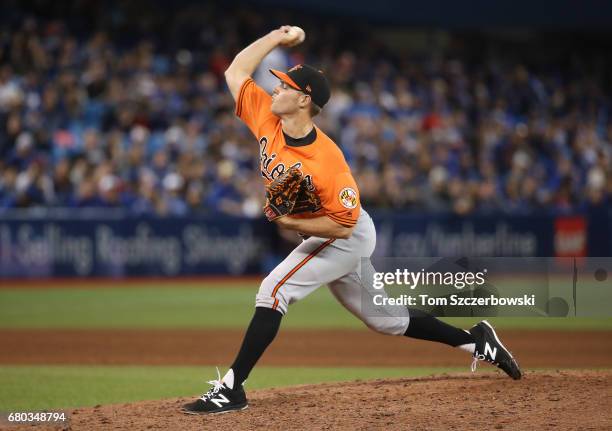 Tyler Wilson of the Baltimore Orioles delivers a pitch in the ninth inning during MLB game action against the Toronto Blue Jays at Rogers Centre on...