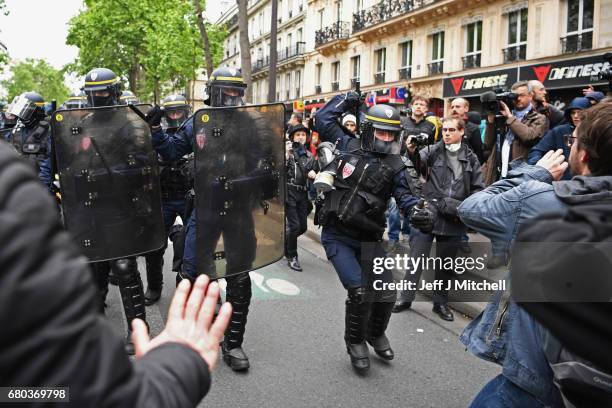 Police control demonstrators on a trade unions demonstrations against the election of Emmanuel Marcon on May 8, 2017 in Paris, France. The centrist...