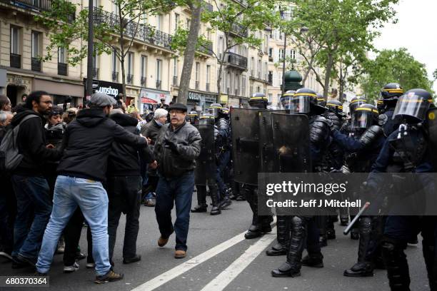 Police control demonstrators on a trade unions demonstrations against the election of Emmanuel Marcon on May 8, 2017 in Paris, France. The centrist...