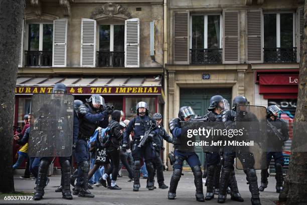 Police control demonstrators on a trade unions demonstrations against the election of Emmanuel Marcon on May 8, 2017 in Paris, France. The centrist...