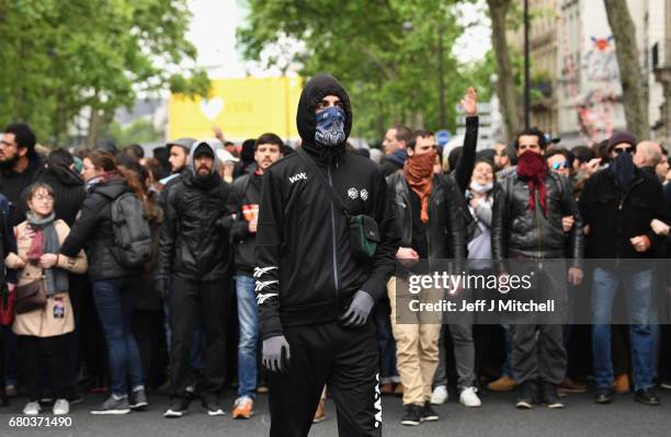 Demonstrators take part in a trade unions demonstrations against the election of Emmanuel Marcon on May 8, 2017 in Paris, France. The centrist...