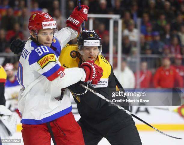 Christian Ehrhoff of Germany challenges Vladislav Namestnikov of Russia during the 2017 IIHF Ice Hockey World Championship game between Germany and...