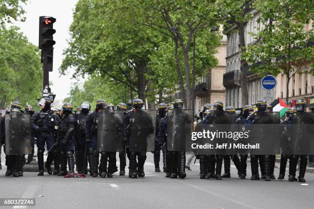 Police control demonstrators on a trade unions demonstrations against the election of Emmanuel Marcon on May 8, 2017 in Paris, France. The centrist...