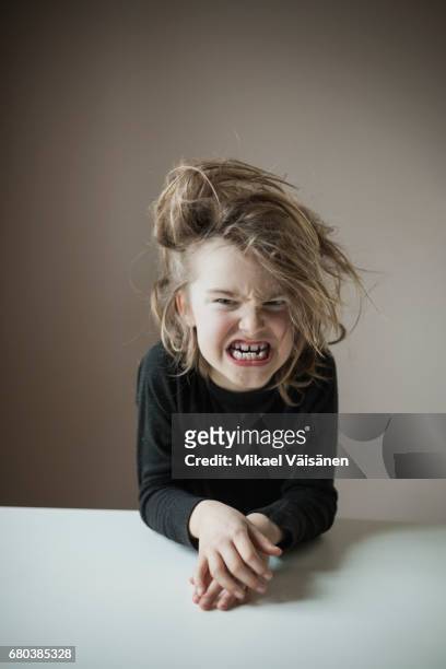 boy with funny hairstyle making faces - maxim stock pictures, royalty-free photos & images