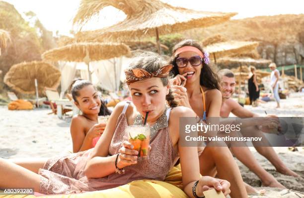 grils having fun on beach - beach party stock pictures, royalty-free photos & images