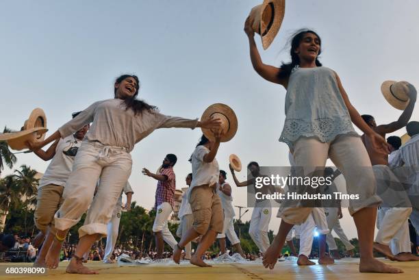 People perform Capoeira during Batizado event at Carter Road, on May 7, 2017 in Mumbai, India. Capoeira is a Brazilian martial art that combines...