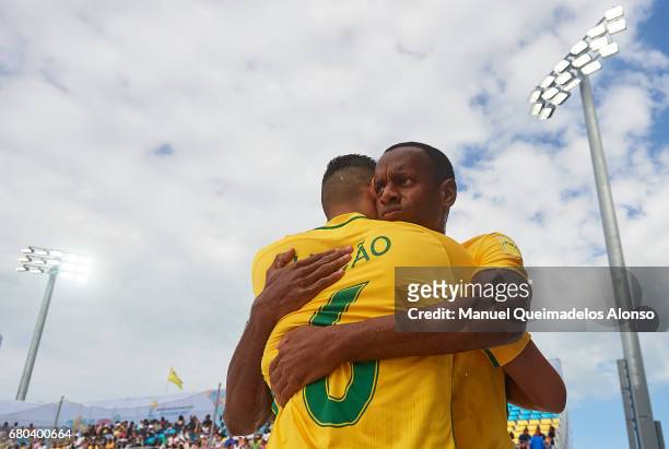 Diogo Catarino of Brazil hugs his team mate Lucao prior to the FIFA Beach Soccer World Cup Bahamas 2017 final match between Tahiti and Brazil at...
