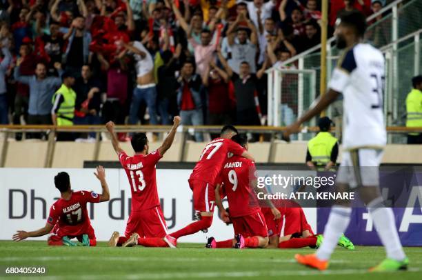 Persepolis' team player celebrate after scoring a goal during the Asian Champions League football match between UAE's Al-Wahda and Iran's Persepolis...