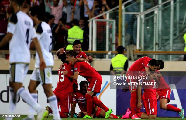 Persepolis' team player celebrate after scoring a goal during the Asian Champions League football match between UAE's Al-Wahda and Iran's Persepolis...