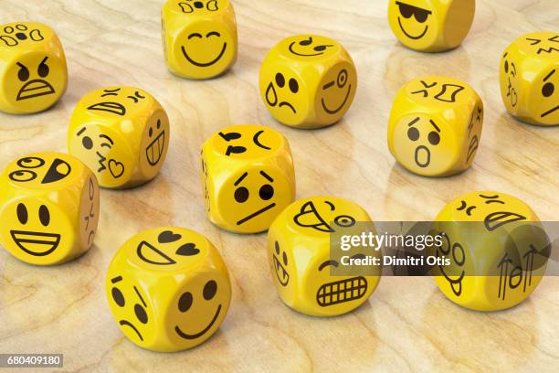 many yellow dice with emoji or emoticon faces - emotion - fotografias e filmes do acervo