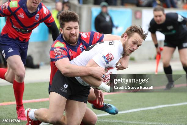 Ryan Burroughs is brought down by Manly Brooker after scoring a try. The Toronto Wolfpack become the first Rugby Canadian team to play in the Rugby...