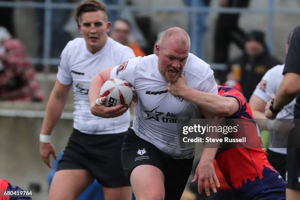 Steve Crossly runs through a tackle. The Toronto Wolfpack become the first Rugby Canadian team to play in the Rugby Football League. They beat the...