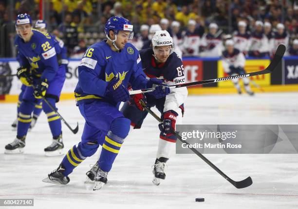Danny Dekeyser of USA challenges Marcus Kruger of Sweden during the 2017 IIHF Ice Hockey World Championship game between USA and Sweden at Lanxess...