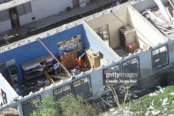 Damaged home is visible in the town of Jaguey Grande in central Cuba November 7, 2001 after Hurricane Michelle swept through the area. Hurricane...