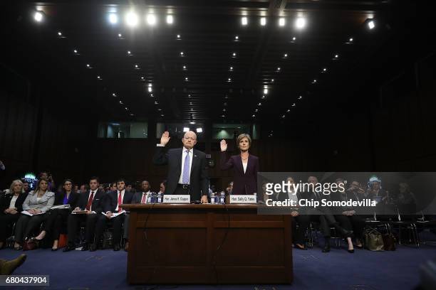 Former Director of National Intelligence James Clapper and former U.S. Deputy Attorney General Sally Yates are sworn in before testifying to the...