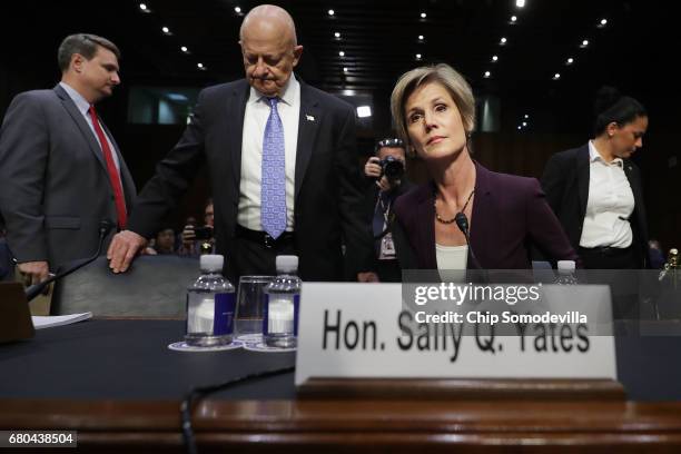 Former Director of National Intelligence James Clapper and former acting U.S. Attorney General Sally Yates arrive before testifying to the Senate...